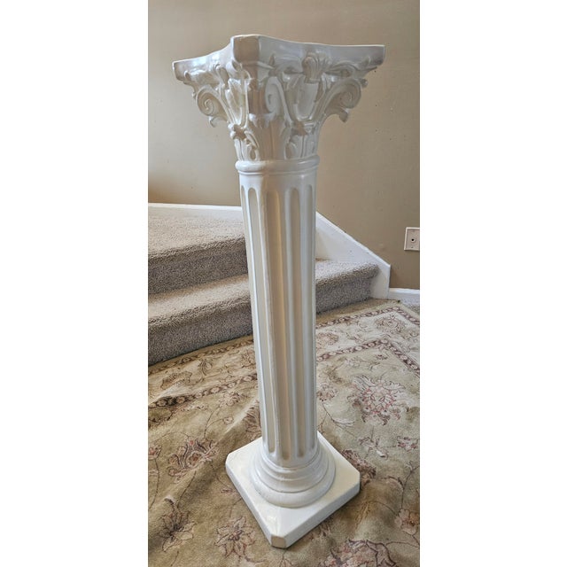 Classic column with a subtly marbleized finish. Beautiful scroll detail.