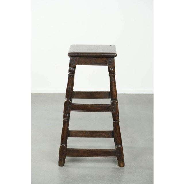 We are offering this unique, tall, 18th-century antique English oak stool with a beautiful patina and lovely colors. This...
