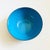 A mid century vintage enameled metal bowl. Vibrant blue enameled interior with a matte gray finish to the exterior metal....