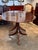 Description: Mahogany dining table with an oval top and a single leaf (leaf shown). Raised on two pedestals, each ending...