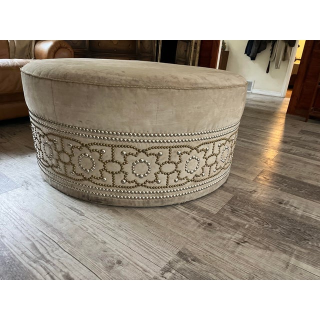 Make a grand statement with this luxurious, custom-designed oversized round cocktail ottoman by the iconic luxury...