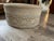 Make a grand statement with this luxurious, custom-designed oversized round cocktail ottoman by the iconic luxury...