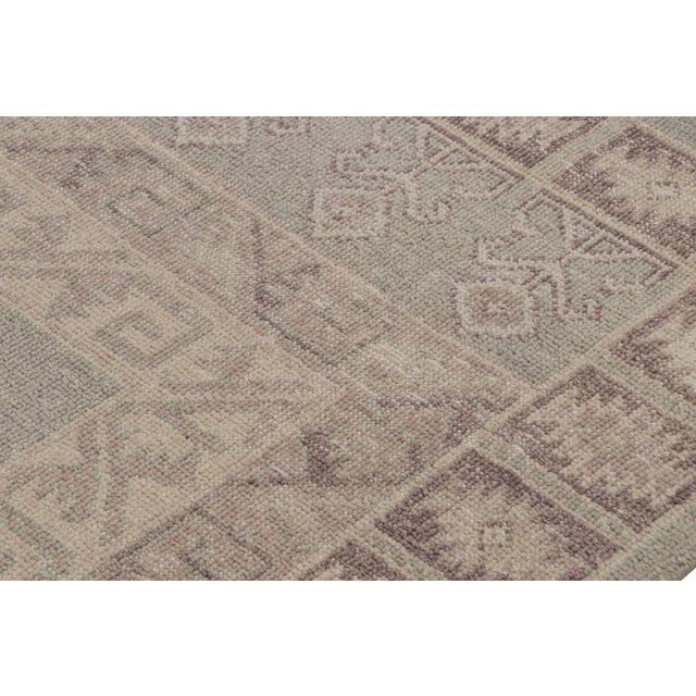 Hand-knotted in wool, this 9x12 tribal style rug is from Rug & Kilim’s Homage collection. On the Design This piece is...