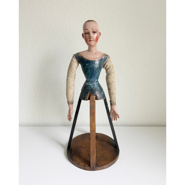 An early religious cage doll figure with soft gazing glass eyes. French origin, mid to late 18th century. Crazing and...