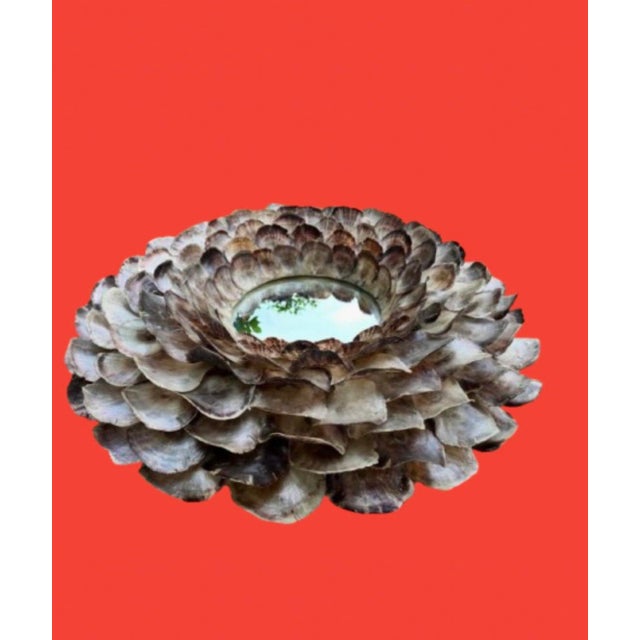 A stunning Coastal mirror, the round frame is lavishly encrusted with organic arrangement of layers of oysters shells...