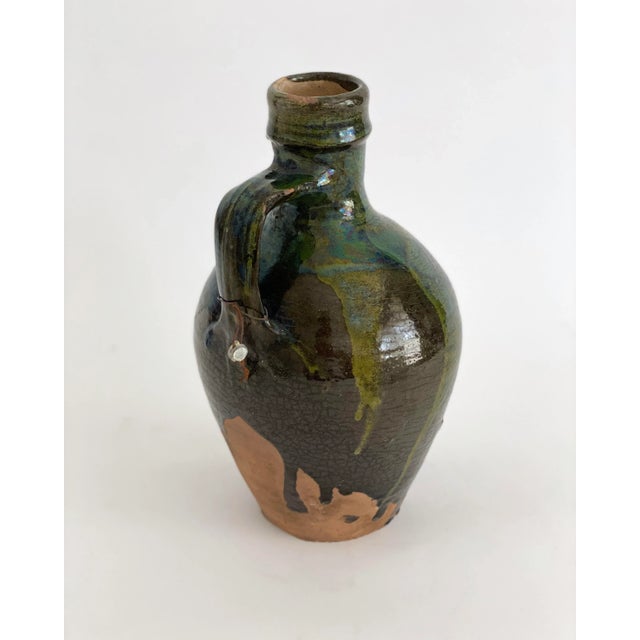 Stunning Turkish earthenware jug with a vibrant green glaze that has time earned patina. Applied single handle and...