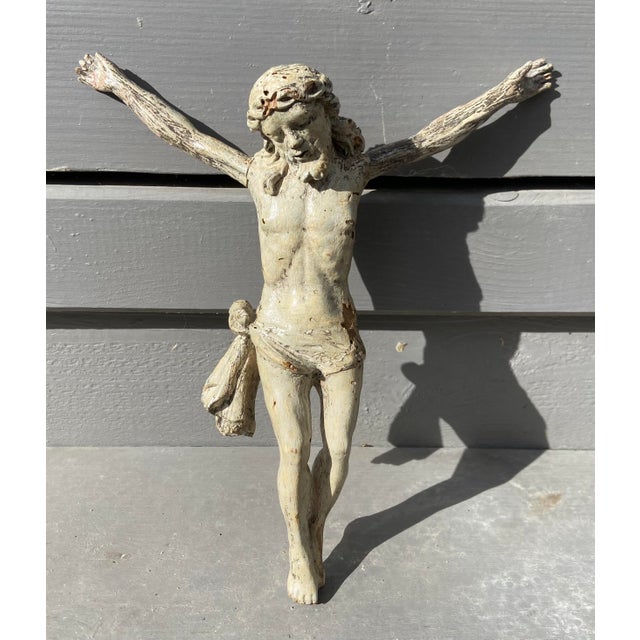 An expressive antique Corpus Christi figure carved in wood and retaining traces of its original polychrome decoration....