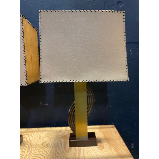 A beautiful pair of table lamps by the Majestic Lamp Company. They are made from Mahogany & Brass with laced fiberglass...