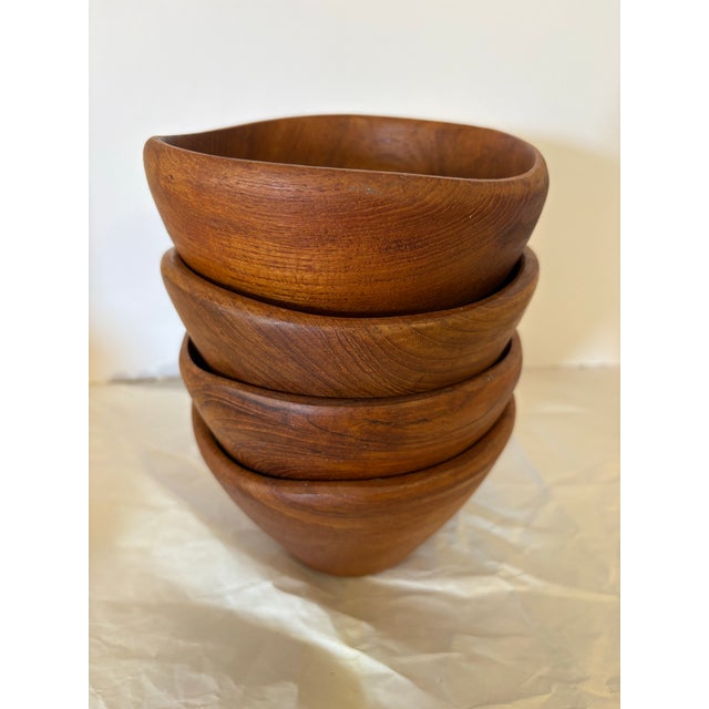A handsome set of four vintage wooden salad bowls by Benjamin & Medwin Inc., each retaining its original “Made in...
