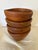 A handsome set of four vintage wooden salad bowls by Benjamin & Medwin Inc., each retaining its original “Made in...
