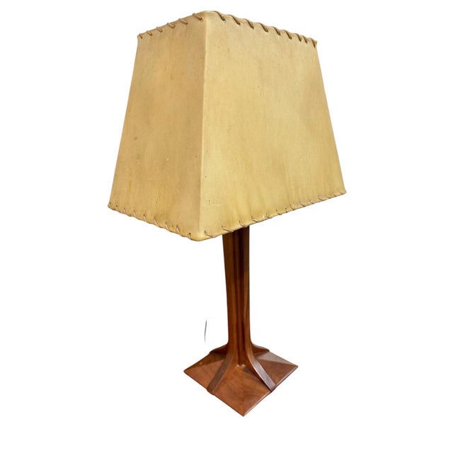 Add warm Mid-Century inspired character to your space with this vintage circa 1990s Stickley walnut table lamp....