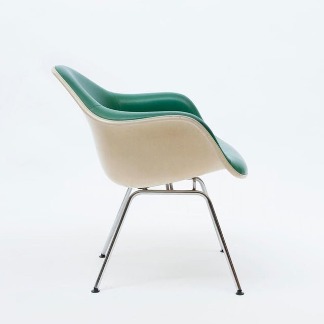 A Dax rope edge fiberglass Zenith shell chair designed by Charles & Ray Eames for Herman Miller Co. with aluminum-finished...