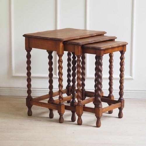 This three-piece set of nesting tables dates from around 1920 and is formally based on Baroque design principles with...