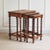 This three-piece set of nesting tables dates from around 1920 and is formally based on Baroque design principles with...