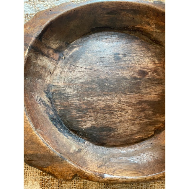 The Antique Wooden Parat Dough Kneading Bowl is a vintage kitchen collectible made of wood, featuring a traditional and...