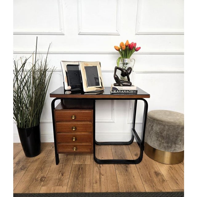 A beautiful and iconic small writing desk, or typewriter table, designed by architect Giuseppe Pagano Pogatschnig around...