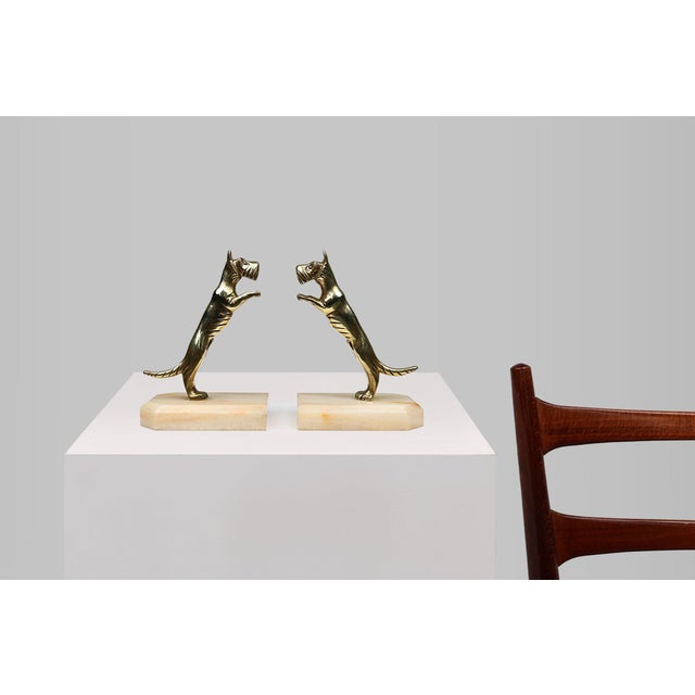 A beautiful detailed set of bookends, featuring two copper terrier dogs each on a marble base. Crafted in France in the...