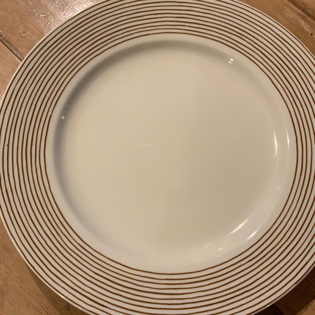 Simply elegant, these Fitz and Floyd “Les Bands” cocoa striped serving plates will look wonderful under your existing...