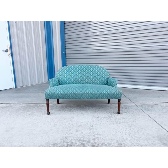 ✨ Vintage Upholstered Settee with Turned Wood Legs ✨ This elegant vintage settee features a timeless silhouette...