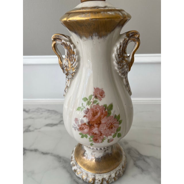 This vintage lamp will grace any room with its by gone charm. Exquisite detailing with double arms and gold flourishes....