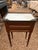 French Louis XVI style mahogany bedside table, 20th c., having inset marble top with pierced gilt-metal three-quarter...