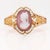 A fine antique Victorian bracelet. In 18 karat yellow gold. With a pink & white carved agate or hardstone cameo of a young...