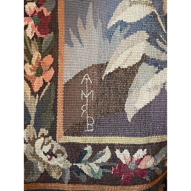A refined 19th century Flemish (Belgium) pictorial verdure tapestry, handwoven in wool and bearing the woven initials...
