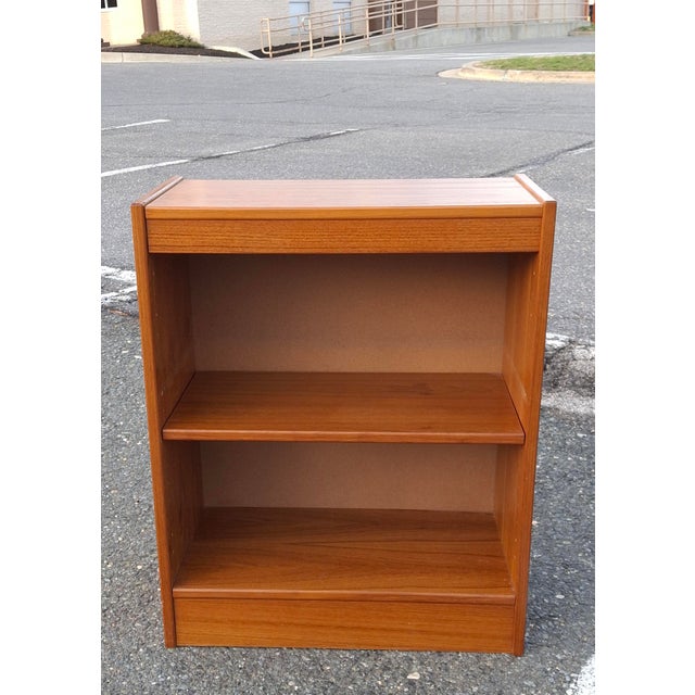 A Mid-Century Danish Modern Style Teak Low Bookcase with and adjustable shelf Each chair measures 30″ high, 12 deep and...