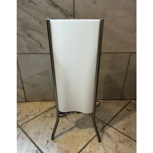 1990s TOTEM Lamp by Italian design house Foscarini. Satin finish Polyethylene shade with metal tripod legs. Switch is on...