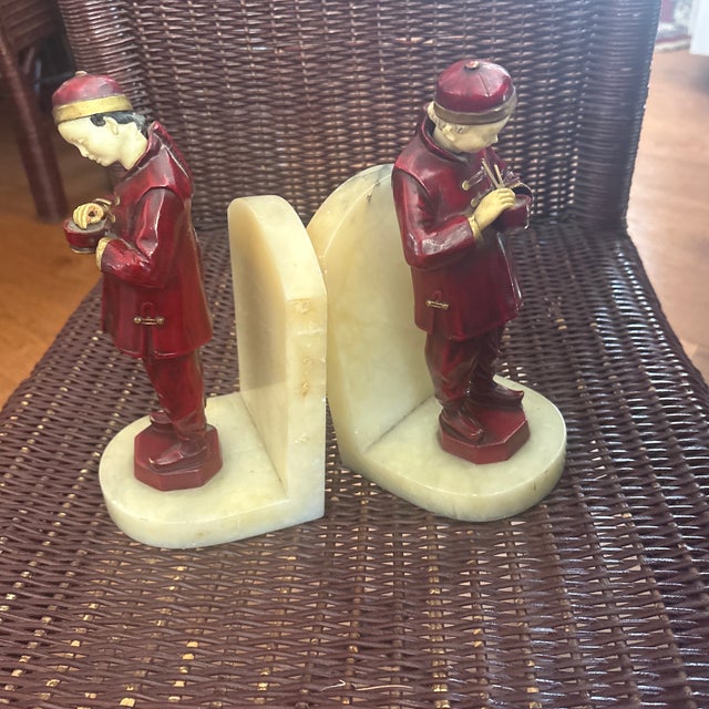 The item in the selected region is an antique Art Deco "Chinese Man Eating" bookend produced around the 1930s by the...