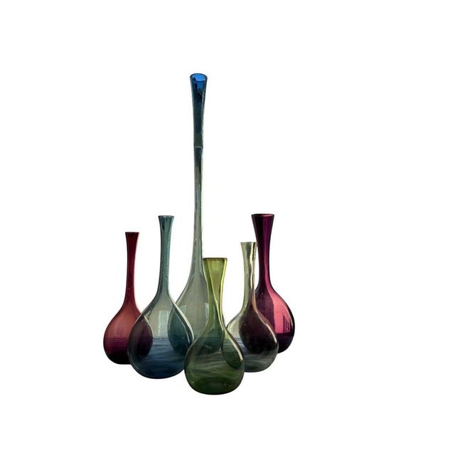 A striking collection of six handblown glass vases designed by Arthur Percy for Gullaskruf Glasbruk, Sweden, circa 1950s....