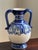 Add a touch of Mediterranean elegance to your home with this stunning amphora-inspired ceramic vase. Beautifully hand-...