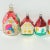 A charming set of hand-painted European glass Christmas ornaments in the shape of colorful cottages. Each miniature house...