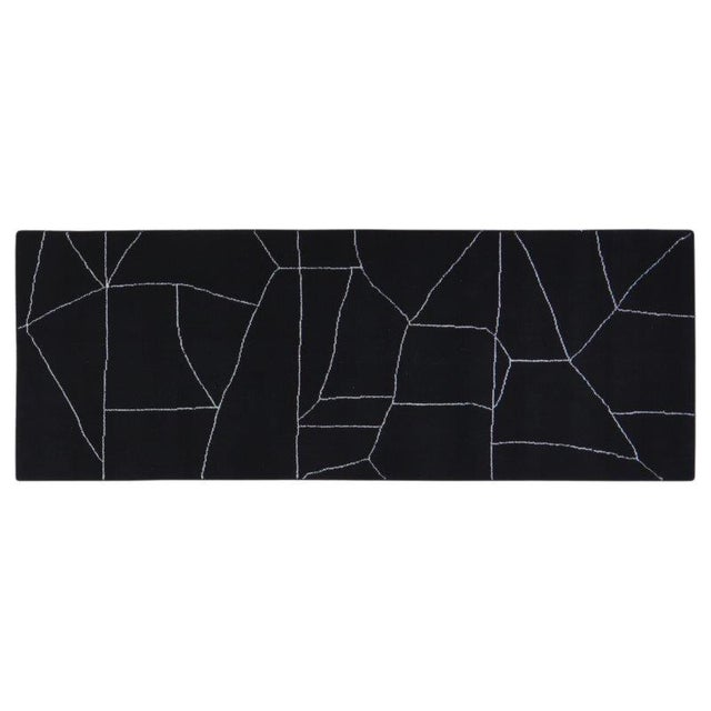 Hand-knotted with care using traditional rug-making techniques, this wool rug blends timeless craftsmanship with a modern...