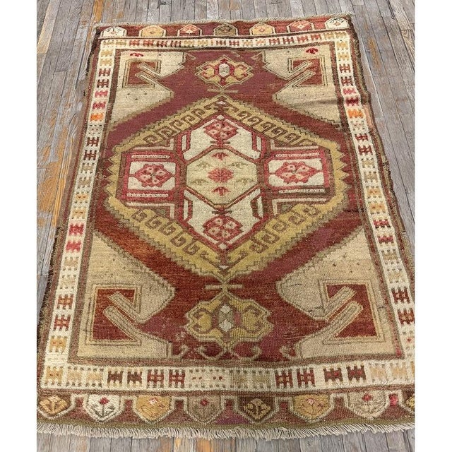 "Dating back to circa 1890, this Antique Turkish Decorative rug is a vibrant and charming example of late 19th-century...