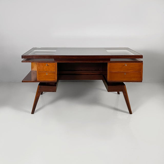 Italian Art Deco desk in dark and light wood and glass with swallow-shaped decorations, 1940s Desk with a rectangular...
