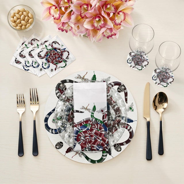 Let your table transition from classic to modern with our Ouroboros Vegan Leather Round Pebble Placemat, featuring an...