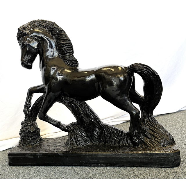 Striking black stallion figure from the mid 20th century. The piece is made of ceramic with a black cold painted finish...