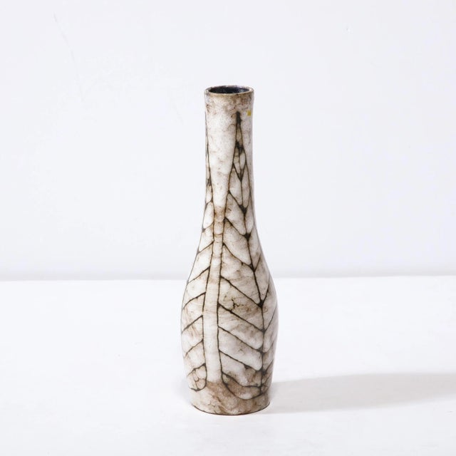 This Mid-Century Modernist Tapered Ceramic Vase with Linear Leaf Motif is a beautiful example of Post War European...