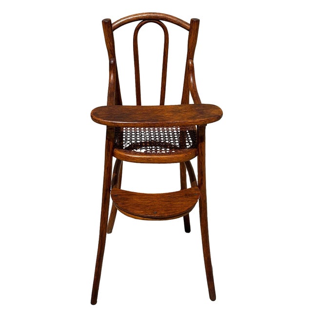 A rare Vienna Secession children's or doll's high chair by Thonet, crafted from beautifully bent oak with a hand-woven...