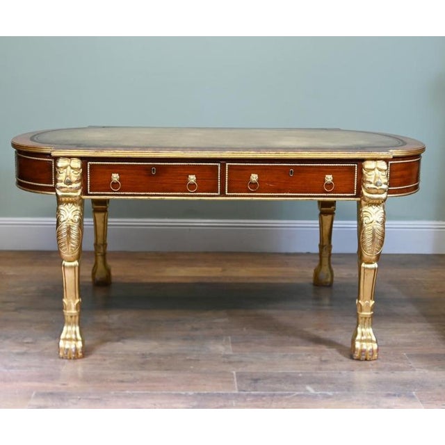 Impressive English Regency style mahogany writing desk dating to circa 1880 The rounded rectangular top is inset with...