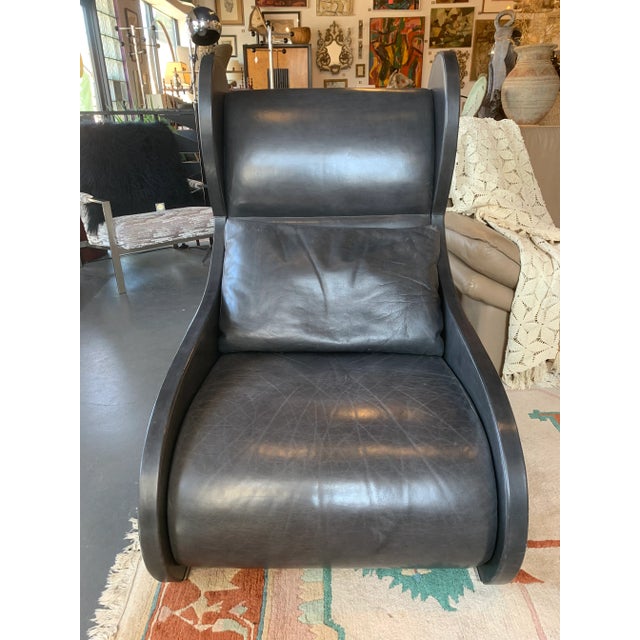 Black Leather Pompeiian Wing Chair in soft charcoal la prima leather with swept back shape on nickel sabots, designed by...