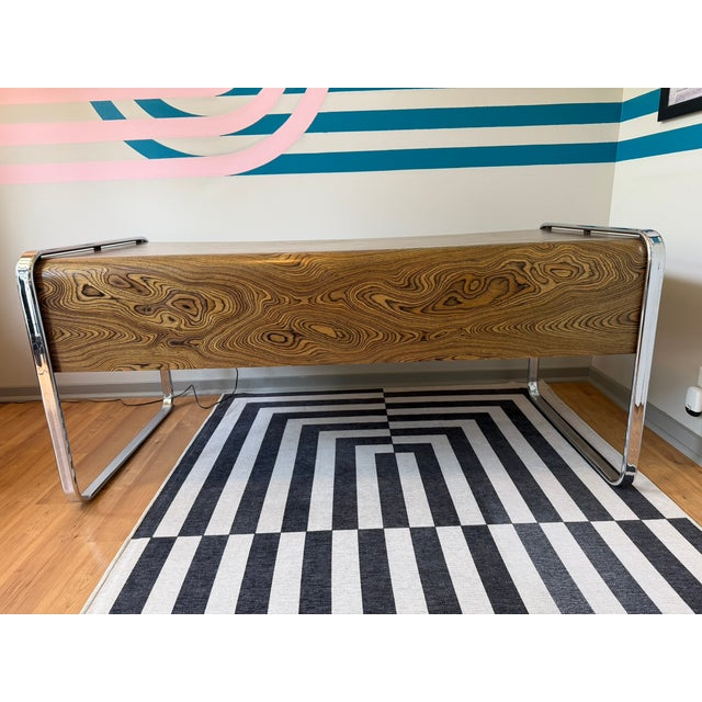 A rare executive desk designed by Peter Protzman for Herman Miller as part of the short-lived Tubular Collection —...