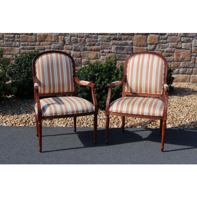 Ethan Allen's version of Louis XVI armchairs is one of refined elegance and quality. The wood grain is lovely! This pair...