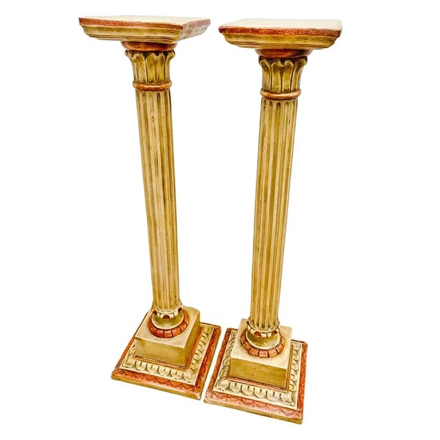 A pair of classic Venetian pedestal columns with elegant elongated fluted shafts, square tops and molded plinths. Made of...