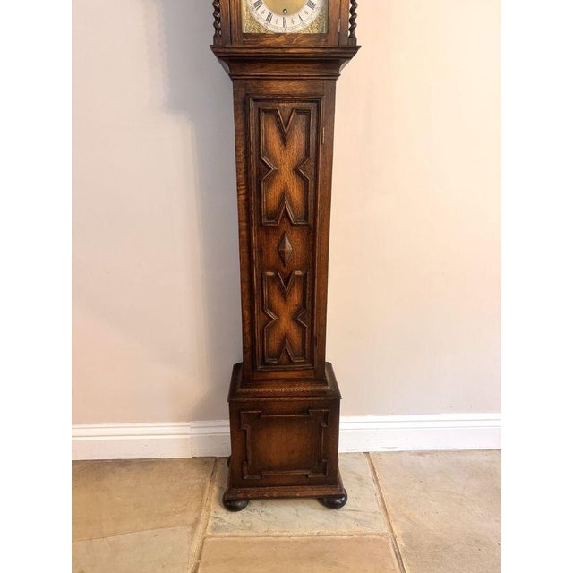Fine Quality Antique Oak 8 Day Chiming Grandmother Clock, having a quality oak case with carved mouldings and fine barley...