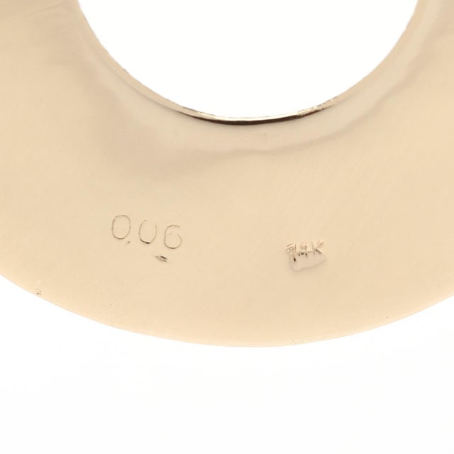 Stones: diamond round brilliant cut .9 mm .06 ctw GH color/ SI1-2 clarity Length: 1 3/8 in. Width: 1 1/8 in. Weight: 2.6...