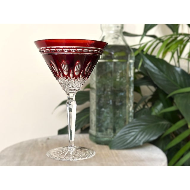 This elegant Waterford Clarendon martini glass features a rich ruby red bowl, cut to clear, paired with a beautifully...