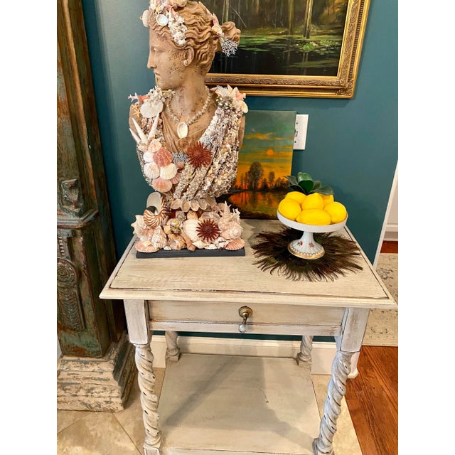Gracefully twisted legs on this beautiful old side table make this piece perfect for almost anywhere. Great place to...