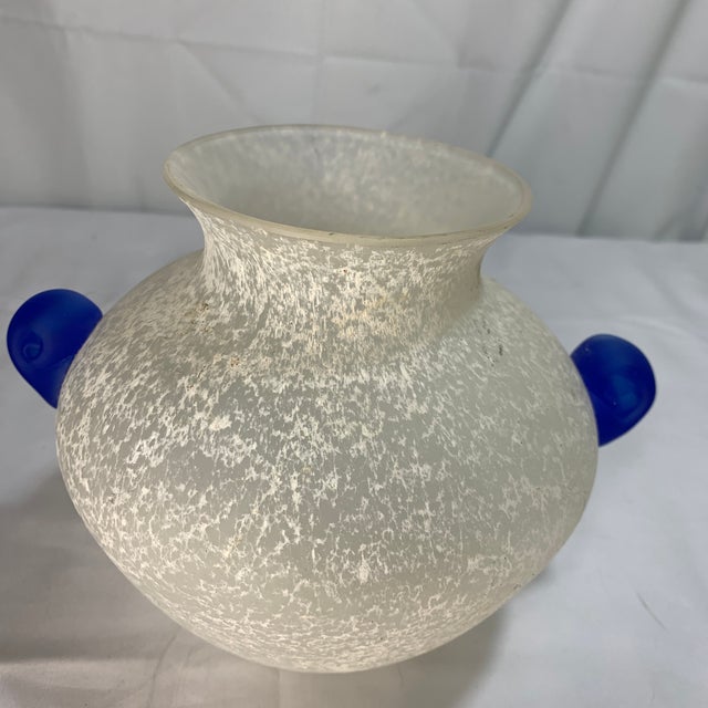 Offered here is a vintage Italian art glass vase featuring a frosted, textured scavo body and bright blue applied side...